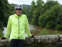 Grumpy man on bridge between Cornwall and Devon